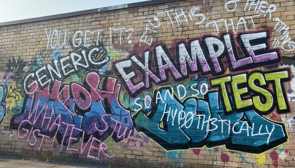 words painted in graffiti in different directions related to generic topic on a brick wall